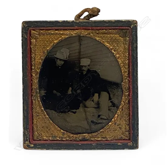 Gilt matted ambrotype - reclining man and woman,
